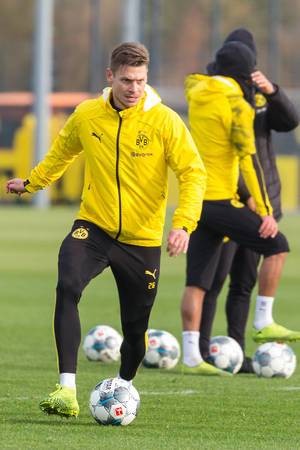 Lukasz Piszczek starts with the ball and looks focused