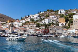 Luxurious yachts in the harbour off Miaouli of saronic island Hydra, Greece