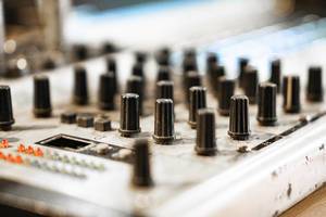 Macro shot of audio mixer knobs (Flip 2019)
