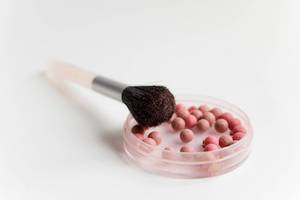 Make up Brush and Cosmetics on White Background