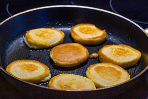 Making pancakes on frying pan
