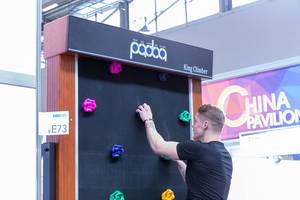 Man climbs the King Climber wall provided by Evertop Hardware Industrial from China at Fibo Cologne