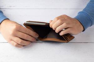 Man hand holding empty wallet
