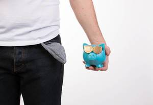 Man holding blue piggybank