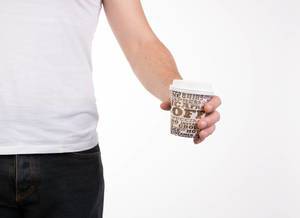 Man holding coffee cup to go