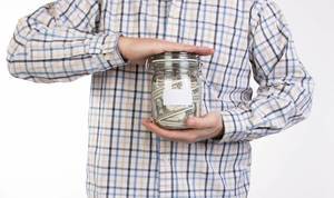 Man in shirt holding money jar