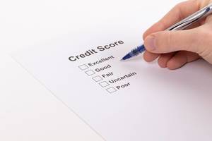 Man selecting credit score result on a document