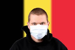 Man wearing protection face mask with flag of Belgium