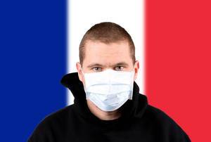 Man wearing protection face mask with flag of France