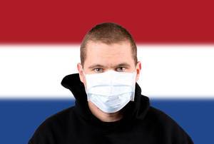Man wearing protection face mask with flag of Netherlands