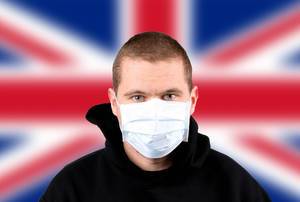 Man wearing protection face mask with flag of United Kingdom