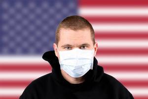 Man wearing protection face mask with flag of USA