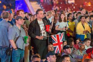 Man with UK flag at fan fest Moscow watching the finals