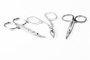 Manicure scissors and tweezers on a white background (Flip 2020)