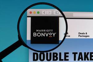 Marriott Bonvoy logo under magnifying glass