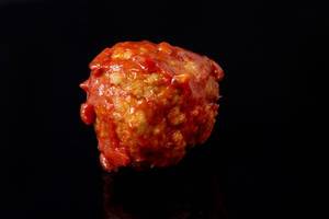 Meatballs with Tomato Sauce on the black background (Flip 2019)