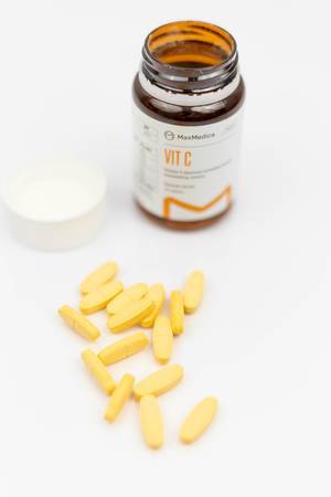 Medicine box with Vitamine C pills above white background
