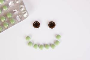 Medicine pills shaped as smilling face