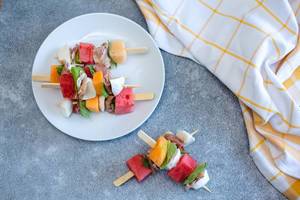 Melon, prosciutto and cheese  skewers top view  (Flip 2019)
