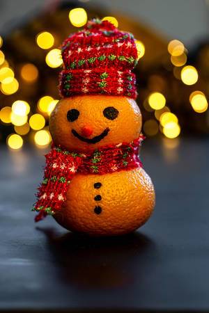 Merry Christmas snowman made from tangerines