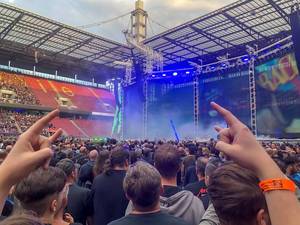 Metal fans at a Metallica concert in the RheinEnergie Stadium in Cologne, during the WorldWired Tour, show the Mano Cornuta