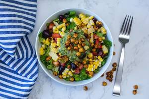 Mexican Salad with Chickpea, Corn and Tomato in a White Bowl