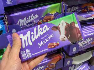 Milka chocolate bar with the image of a real cow in original colours instead of their usual lilac cow