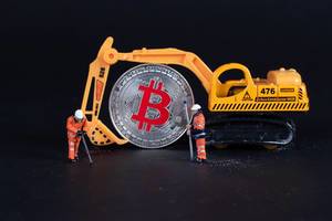 Miniature excavator with workers and Bitcoin