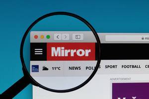 Mirror logo under magnifying glass