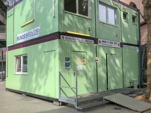 Mobile Federal Police station of the German Bundespolizei in a multi-storey green container at trainstation forecourt in Cologne, Germany