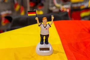 Model figure of a German football fan with flag