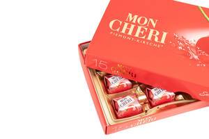 Mon Cheri Chocolate with copy space above white background