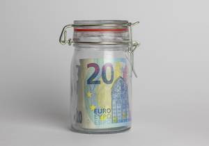 Money jar containing 20 Euros