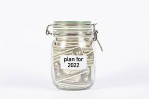 Money jar with plan for 2022 label