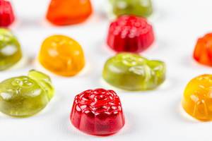 Multicolored jelly candies on a white background (Flip 2020)