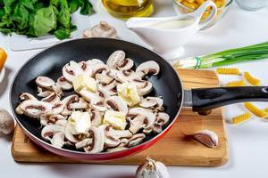 Mushrooms with butter in a frying pan