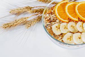 Natural healthy Breakfast-a variety of grain and cereals with orange and banana