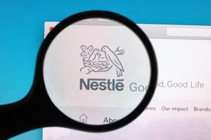 Nestle logo under magnifying glass
