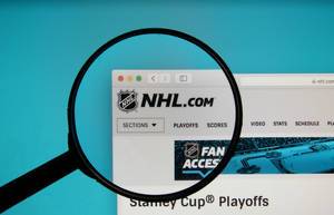 NHL logo on a computer screen with a magnifying glass