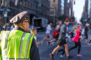 NYPD Officer on a road crossing at New York marathon