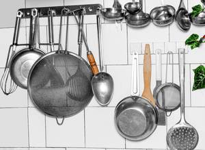 Old kitchen utensils hanging on the wall