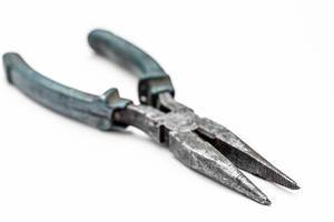 Old pliers on a white background