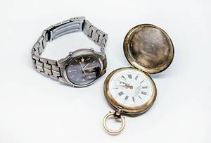 Old Pocket Watch And Titan watch isolated on the white background