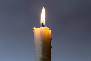 One burning candle on a dark background (Flip 2020)