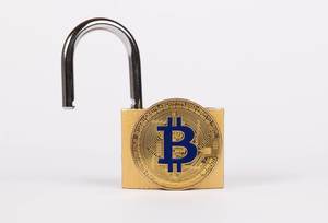 Open padlock with golden Bitcoin on white background