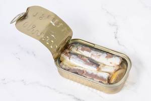 Opened Canned Sardines Fish on the table (Flip 2019)