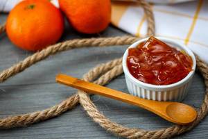Orange Jam With Wooden Spoon