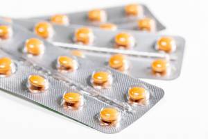 Orange pills close up. The concept of medicine, pharmacology