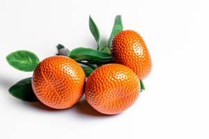 Orange tangerines with green leaves fridge magnets