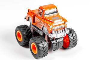 Orange toy car with big wheels